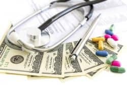 Dollars, stethoscope, pills and medical form. Costs for the medical insurance.